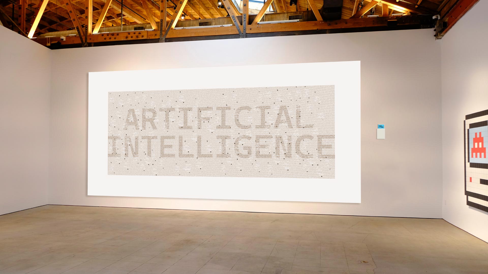 Artificial Intelligence Is mock-up in space, including a wall-mounted visual accompanied by a set of cards mounted on the wall.
